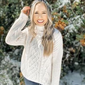 cream turtleneck sweater